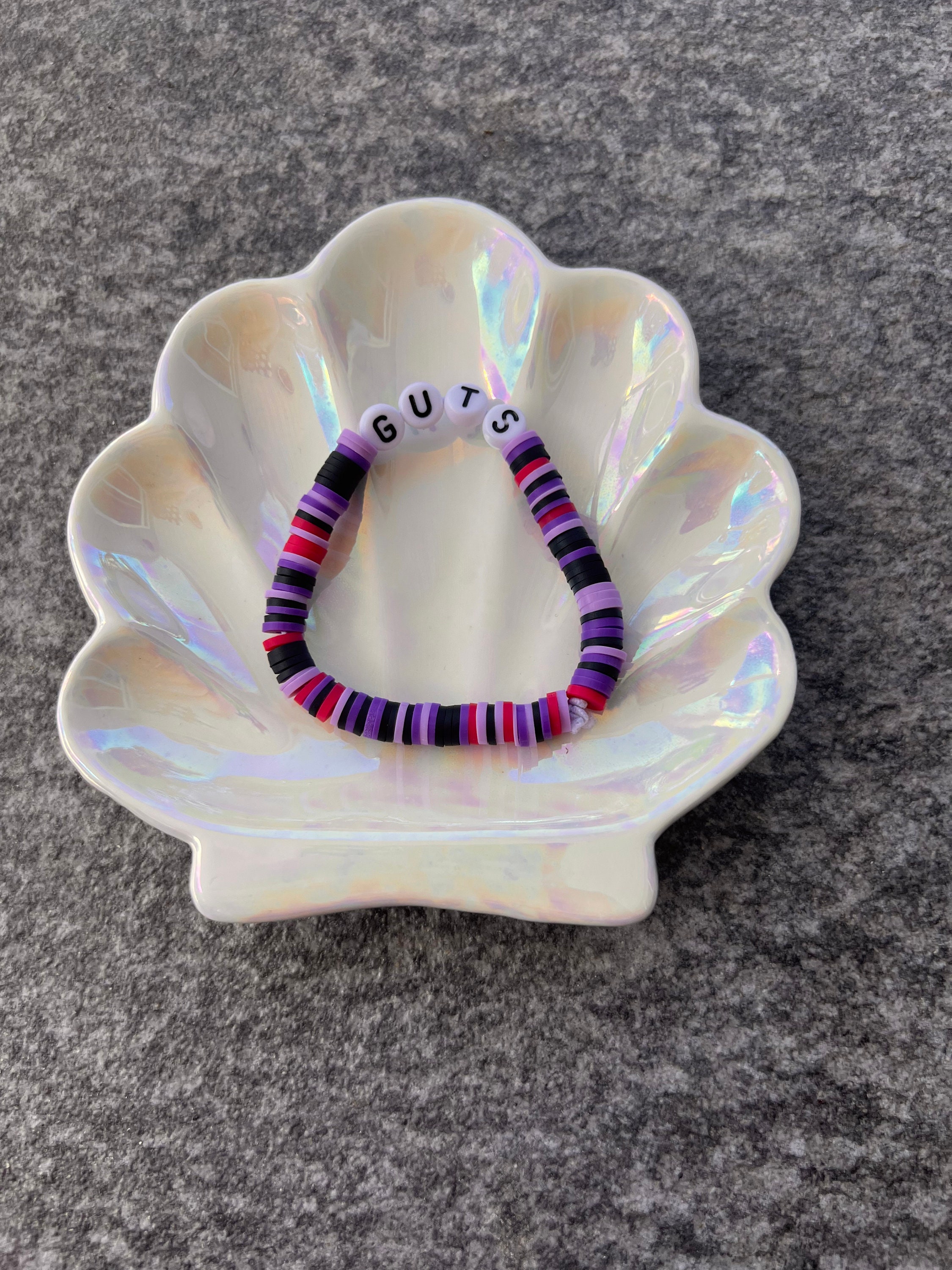 Olivia Rodrigo guts clay bead bracelet